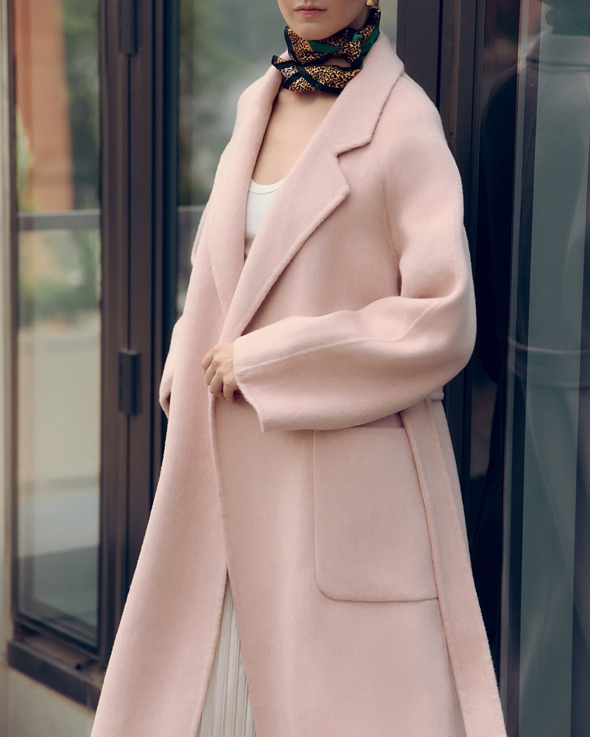 Soft pink oversized wool-blend coat for women featuring wide lapels, drop shoulders, and large patch pockets. Designed with minimalist Japanese tailoring for a relaxed yet elegant silhouette. Perfect for fall and winter layering, this robe-style coat embodies timeless slow fashion and effortless sophistication — crafted for comfort, warmth, and modern everyday wear.