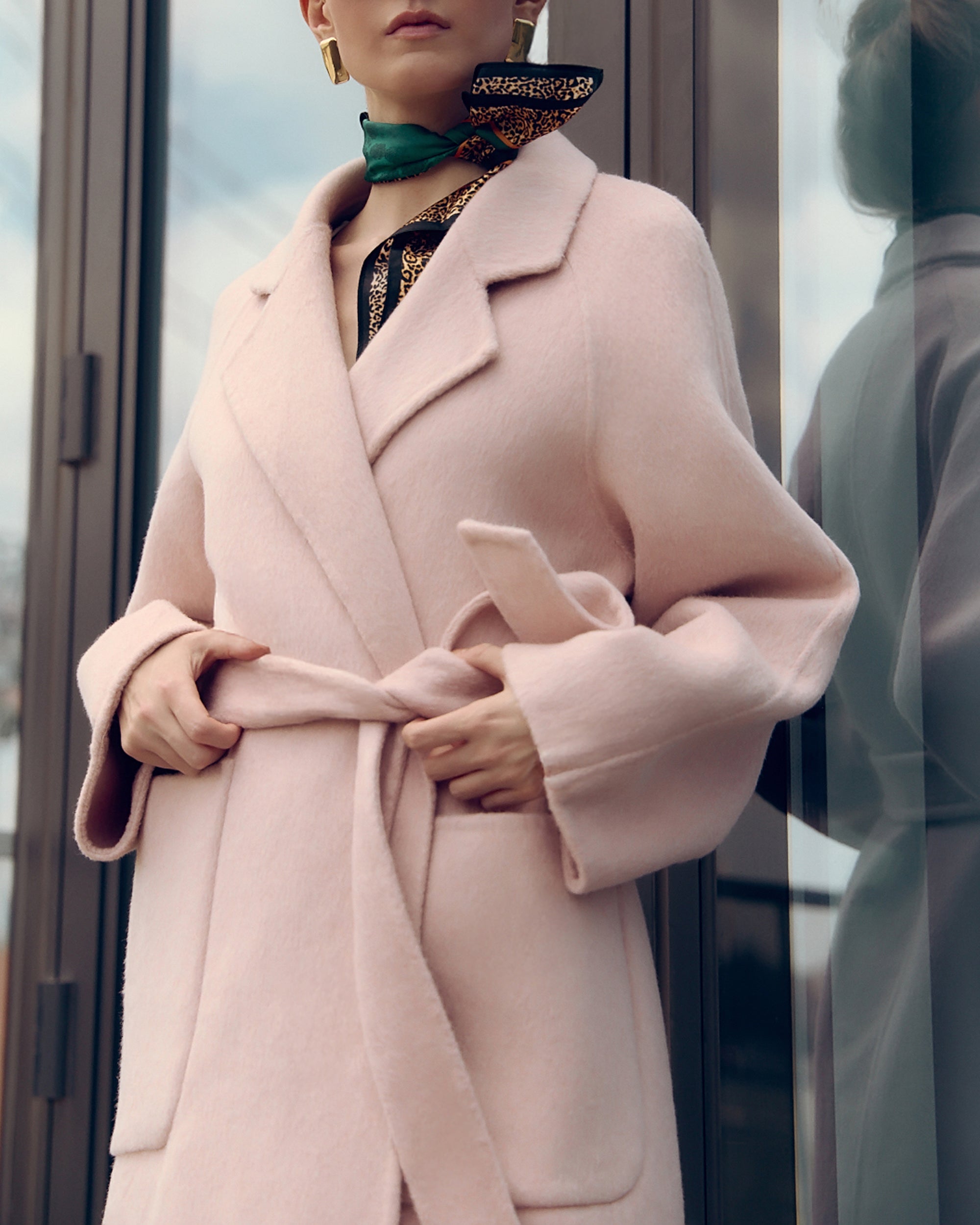 Agnaia soft pink oversized wool-blend coat for women featuring wide lapels, drop shoulders, and large patch pockets. Designed with minimalist Japanese tailoring for a relaxed yet elegant silhouette. Perfect for fall and winter layering, this robe-style coat embodies timeless slow fashion and effortless sophistication — crafted for comfort, warmth, and modern everyday wear.