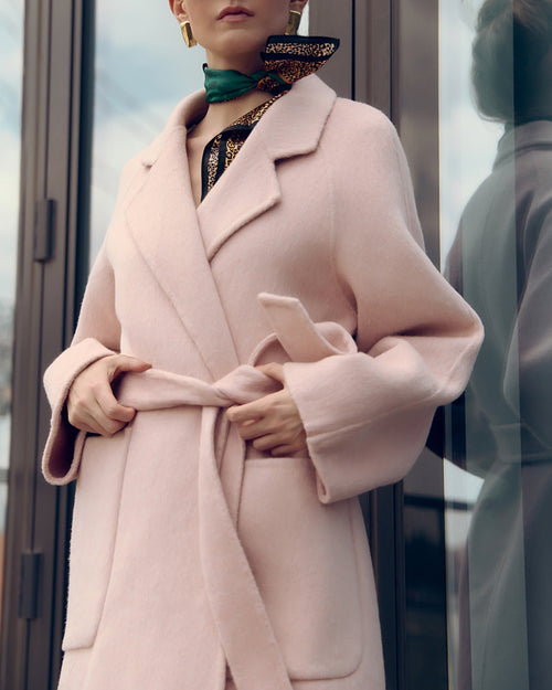 Agnaia soft pink oversized wool-blend coat for women featuring wide lapels, drop shoulders, and large patch pockets. Designed with minimalist Japanese tailoring for a relaxed yet elegant silhouette. Perfect for fall and winter layering, this robe-style coat embodies timeless slow fashion and effortless sophistication — crafted for comfort, warmth, and modern everyday wear.