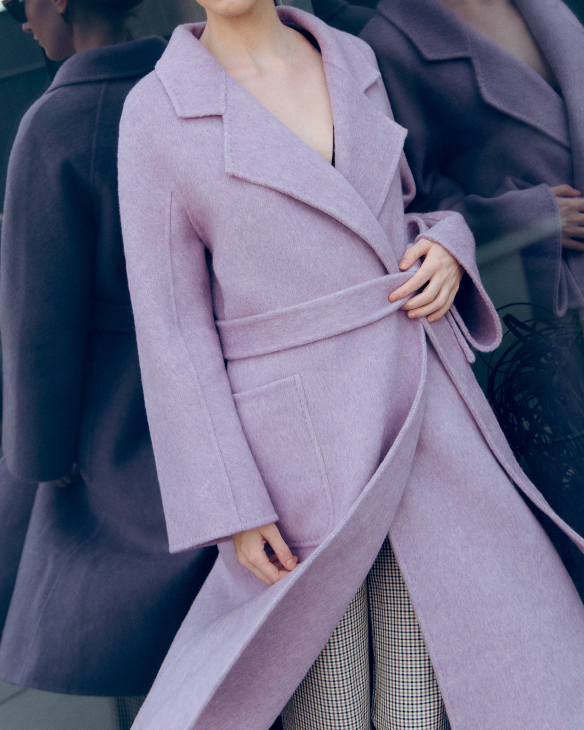 Lavender wool-cashmere robe coat with wide lapels, self-tie belt, and oversized silhouette. Soft brushed texture and elegant drape for modern layering