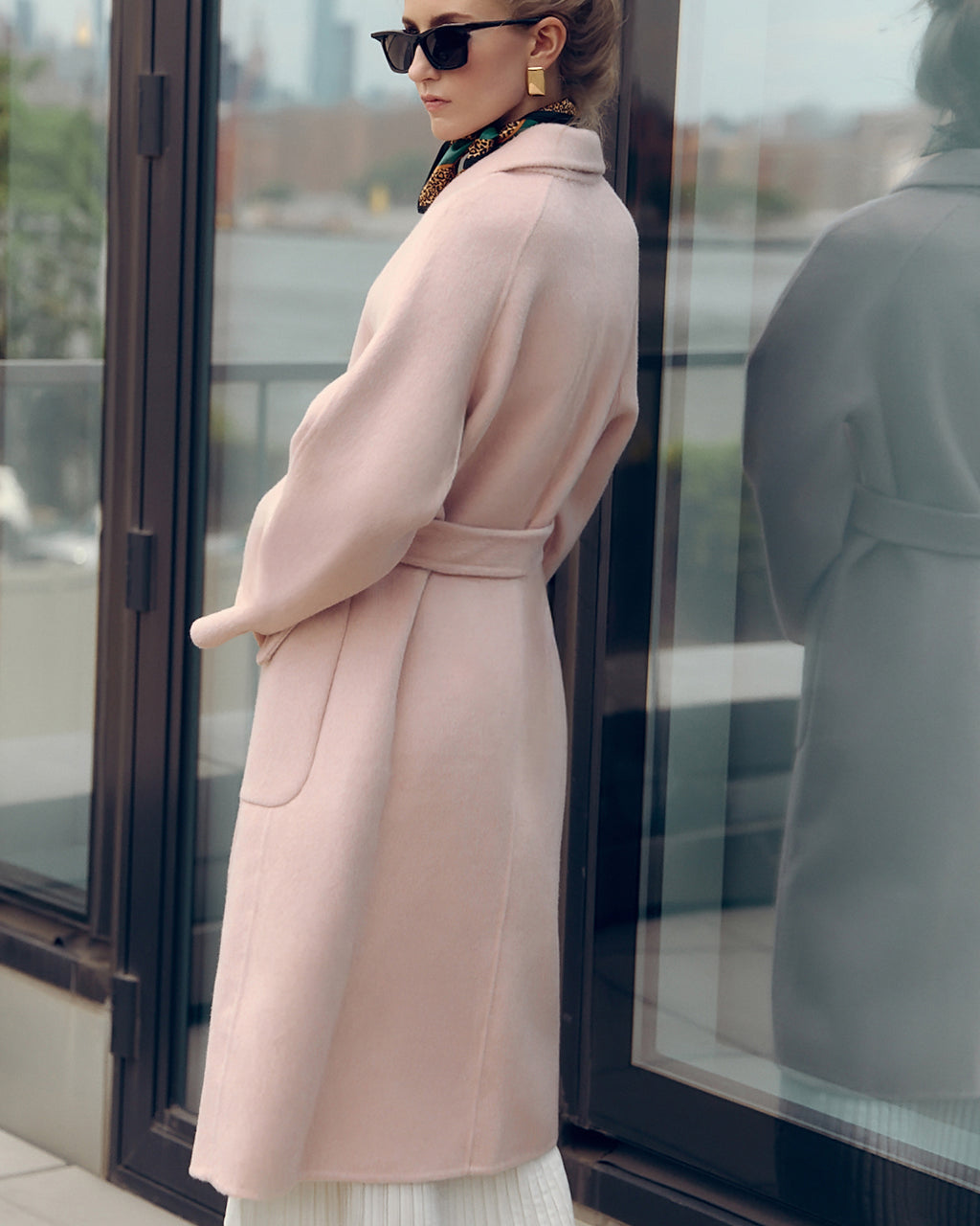 Agnaia soft pink oversized wool-blend coat for women featuring wide lapels, drop shoulders, and large patch pockets. Designed with minimalist Japanese tailoring for a relaxed yet elegant silhouette. Perfect for fall and winter layering, this robe-style coat embodies timeless slow fashion and effortless sophistication — crafted for comfort, warmth, and modern everyday wear.