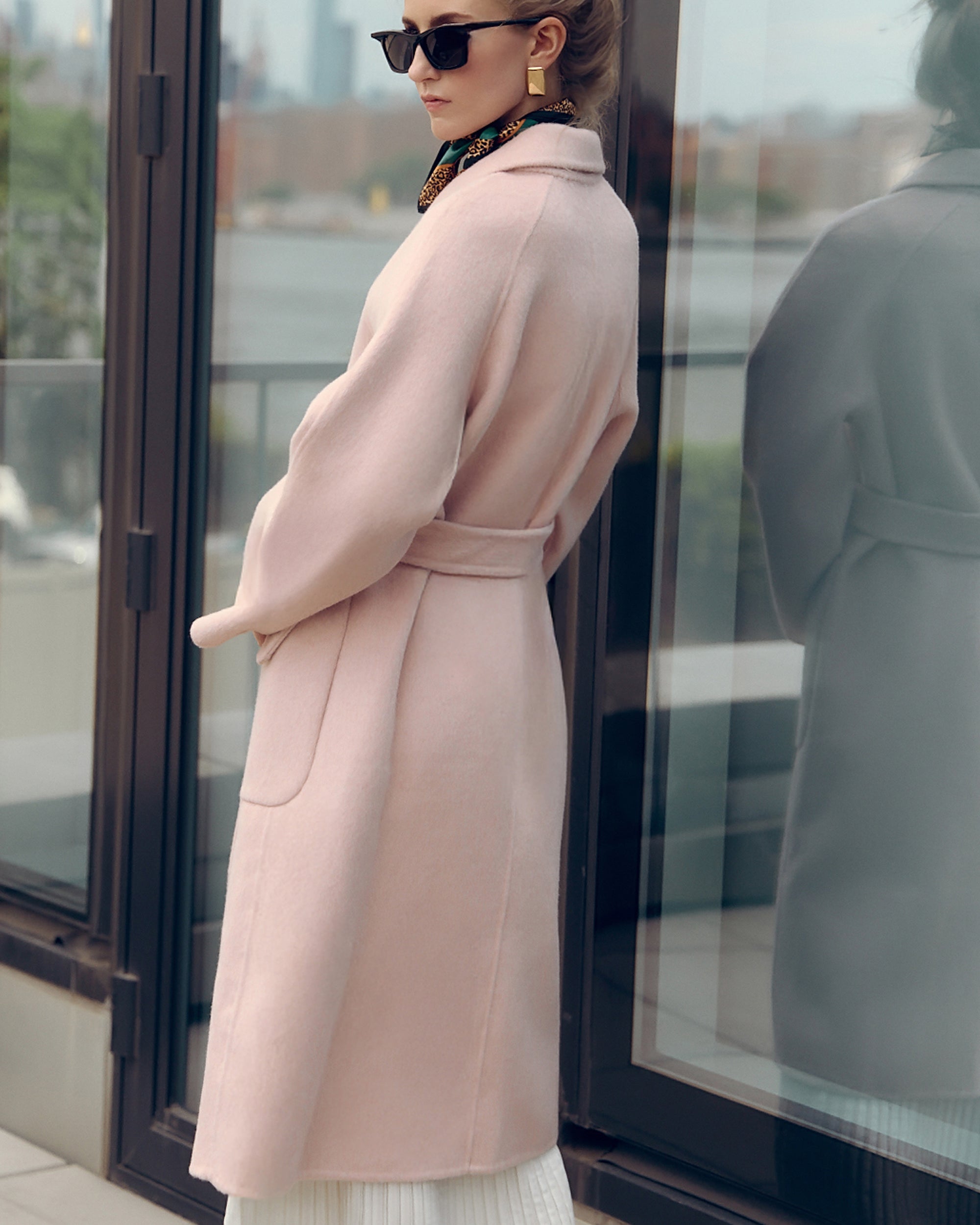 Agnaia soft pink oversized wool-blend coat for women featuring wide lapels, drop shoulders, and large patch pockets. Designed with minimalist Japanese tailoring for a relaxed yet elegant silhouette. Perfect for fall and winter layering, this robe-style coat embodies timeless slow fashion and effortless sophistication — crafted for comfort, warmth, and modern everyday wear.